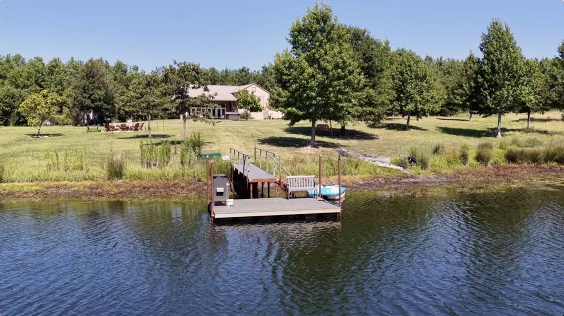 Aerial view of the private dock and pond at Whispering Pines Retreat